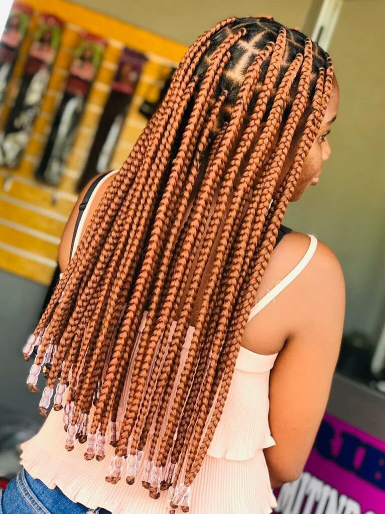 Brown Braids with Beads is a style with brown braids