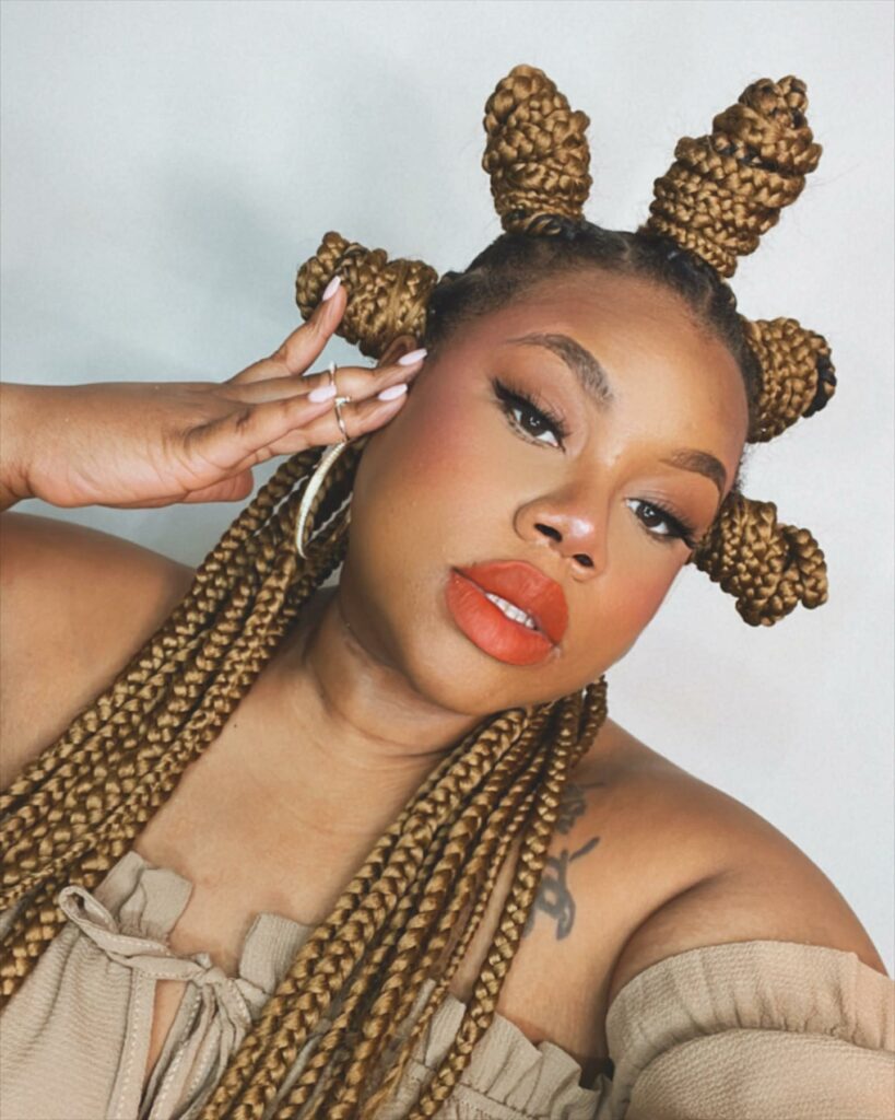 Image of Bantu Knots on Braids in the style of Bantu Knots with Braids