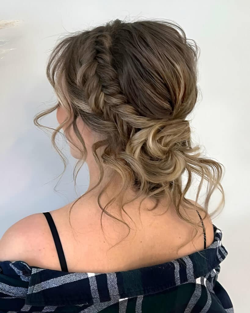 Image of Braided Side Bun With Curly Hair inspired by Side Bun Hairstyles