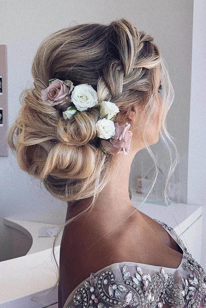 Image of Braided side Bun With Flowers inspired by Side Bun Hairstyles