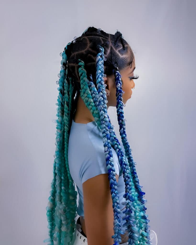 Image of Braids With Green Extensions in the style of Braid Extensions