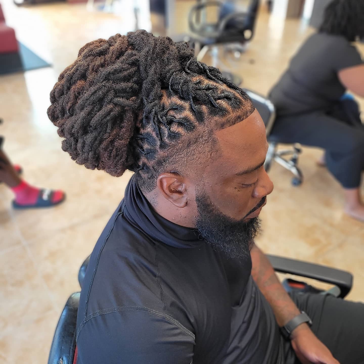 Image of Low Bun Locs inspired by Dreadlocks Hairstyles for Men